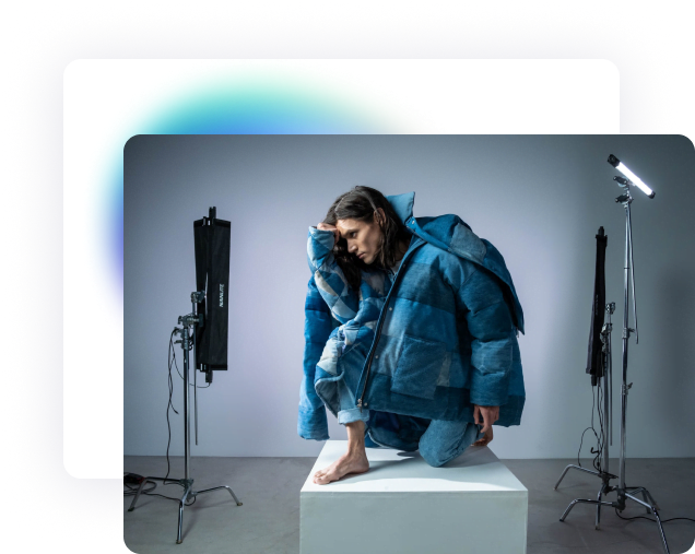 A male model in blue jacket and jeans pants is doing squad pose in the studio